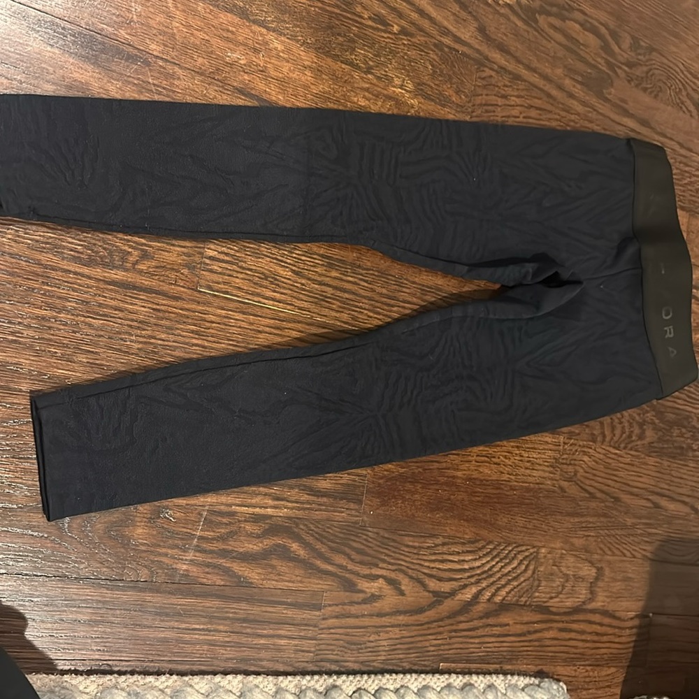 KORAL xs kids black leggings with a muted leopard background